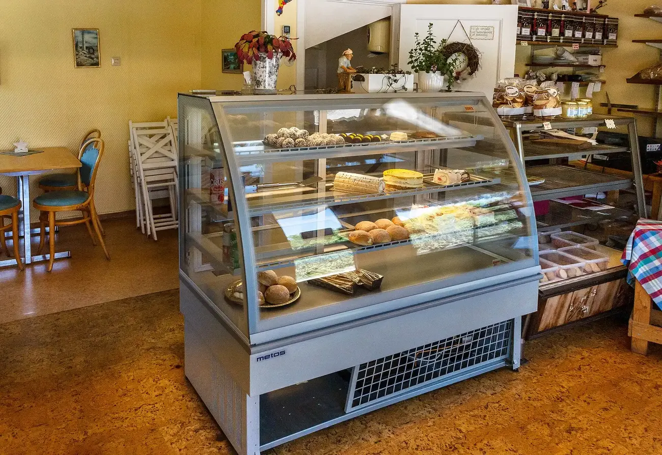 Cake and pastry display cases inside a bakery in Brastad, Sweden.