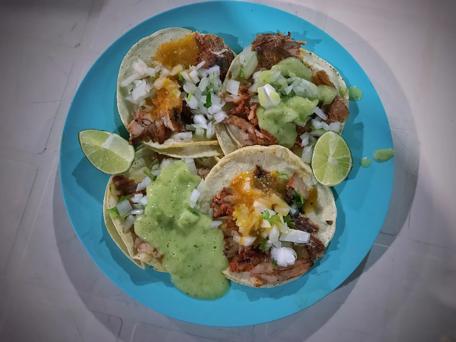 Al pastor tacos at a taqueria in Tulum, Mexico.