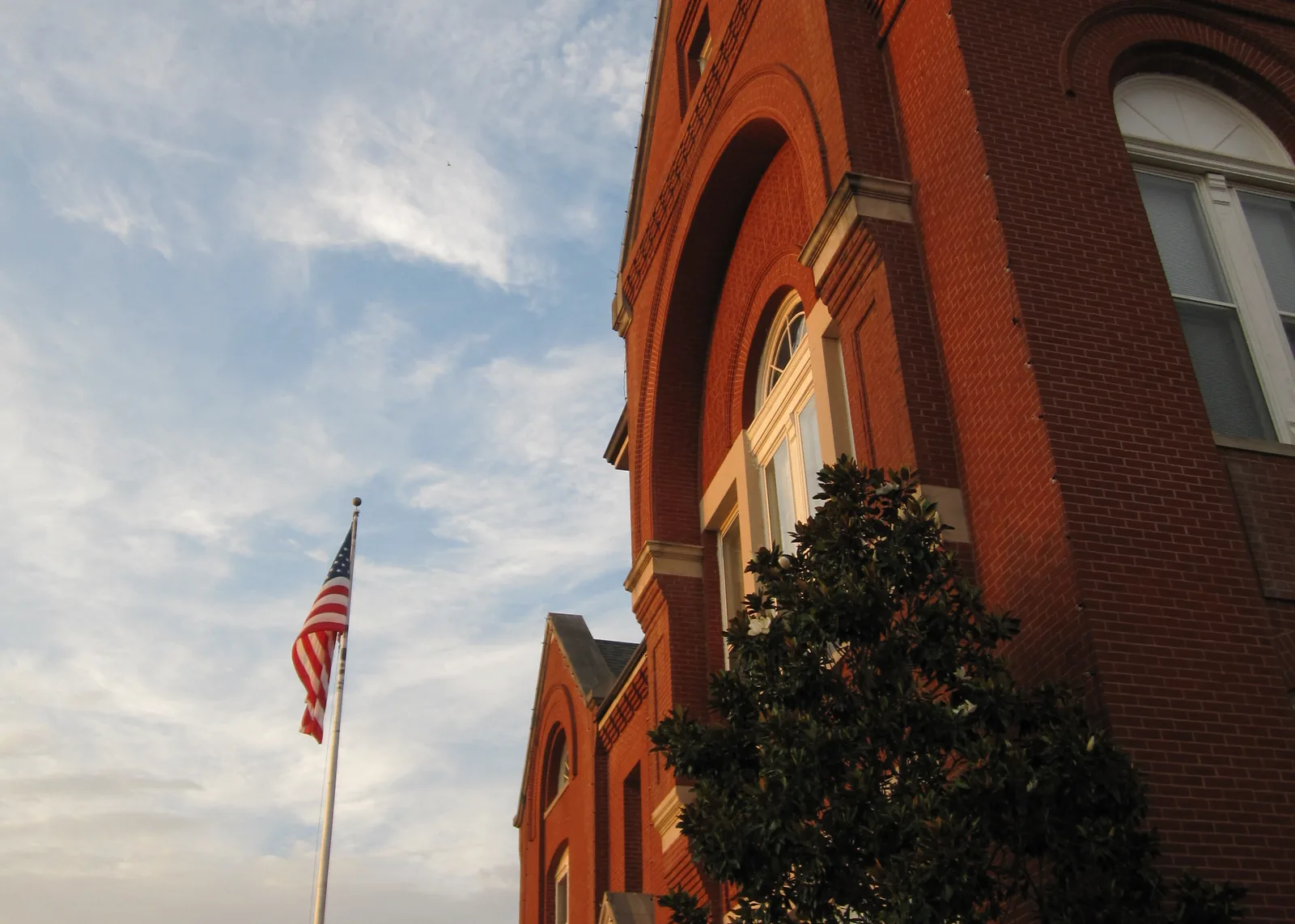 Evening light on Oxford City Hall, where city boards meet and post their hearing notices.