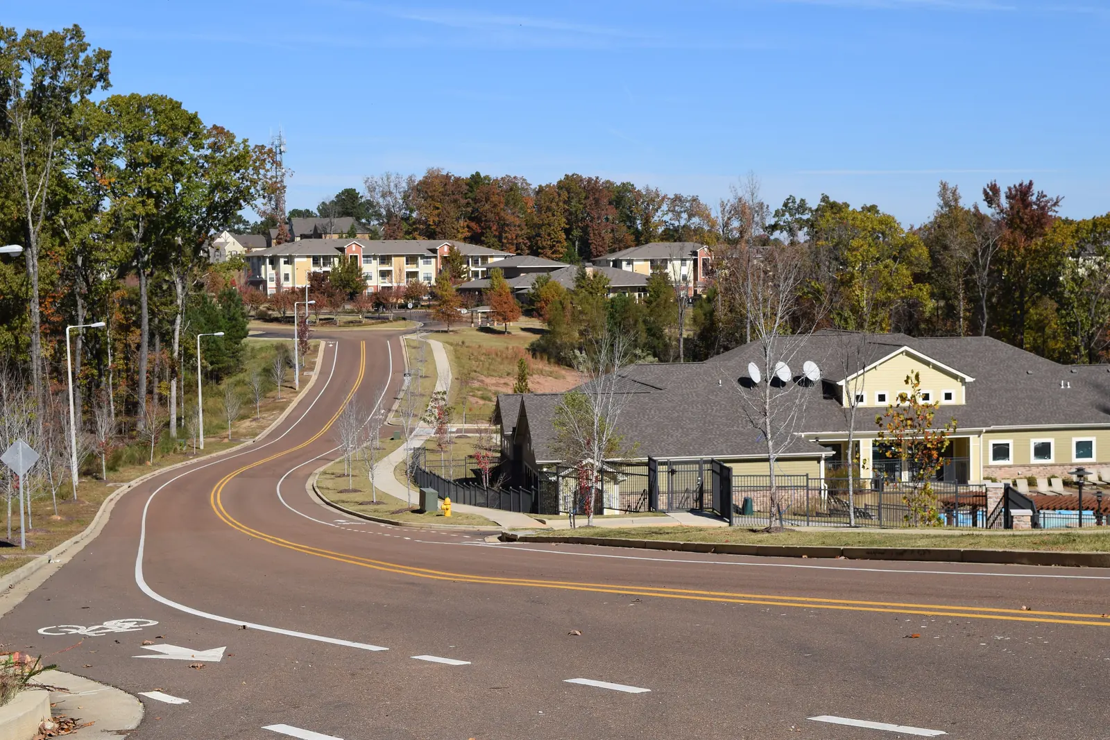 Oxford Way, with bike lanes and sidewalks, runs past apartment complexes in Oxford.